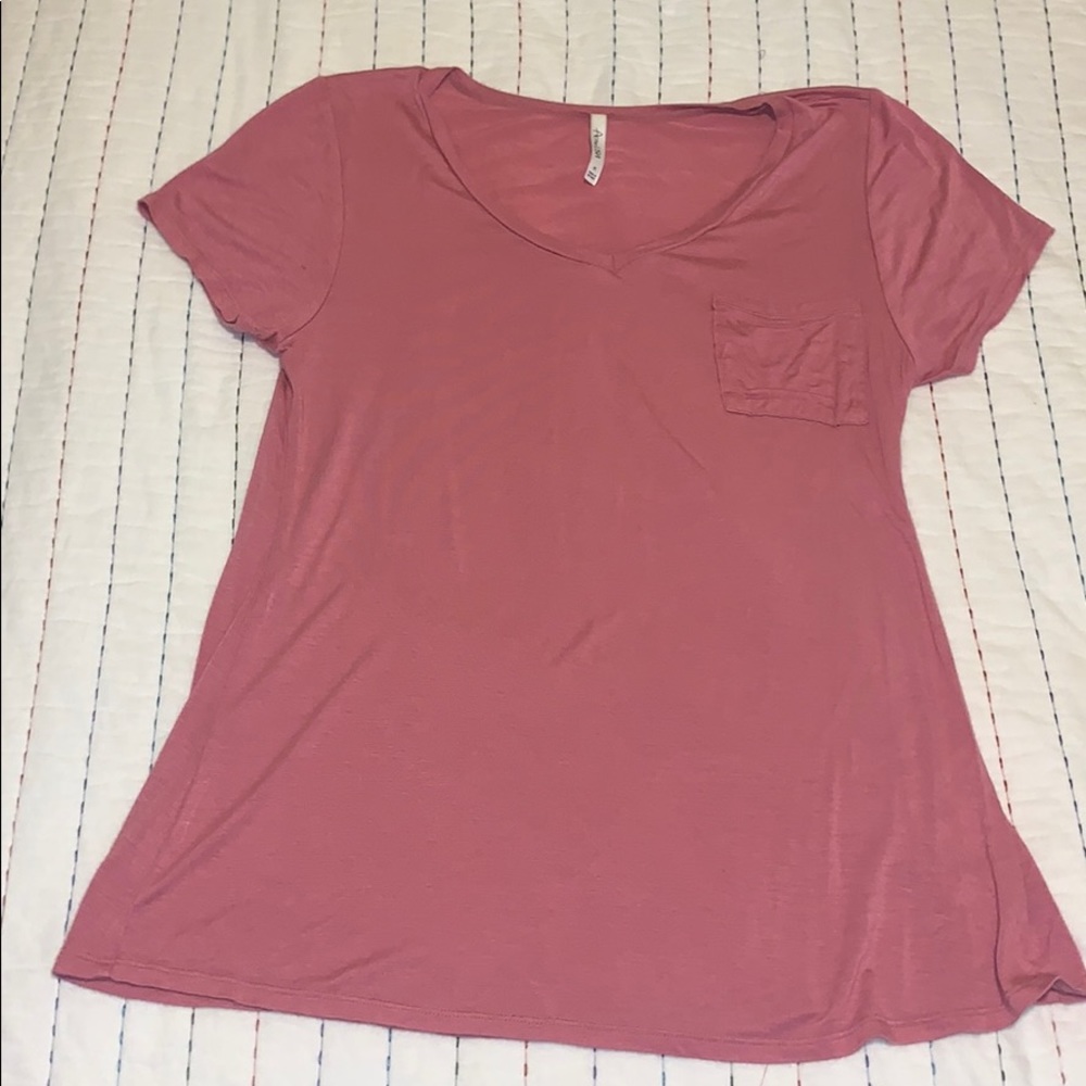 A cute pink v neck T-shirt with a small pocket!